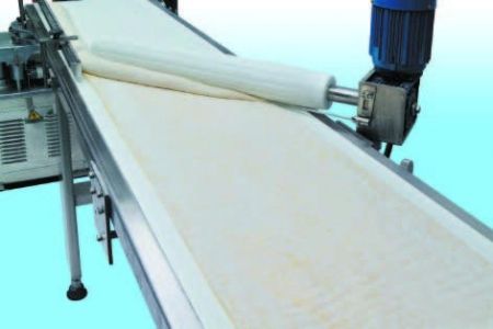 Automatic Layer & Stuffed Paratha Production Line - Rolling mechanism rolls up the dough belt into a dough bar by means of the speed different between the special rollers and conveyor. It can equip an extra stuffing extruder to roll up a stuffed dough cylinder.