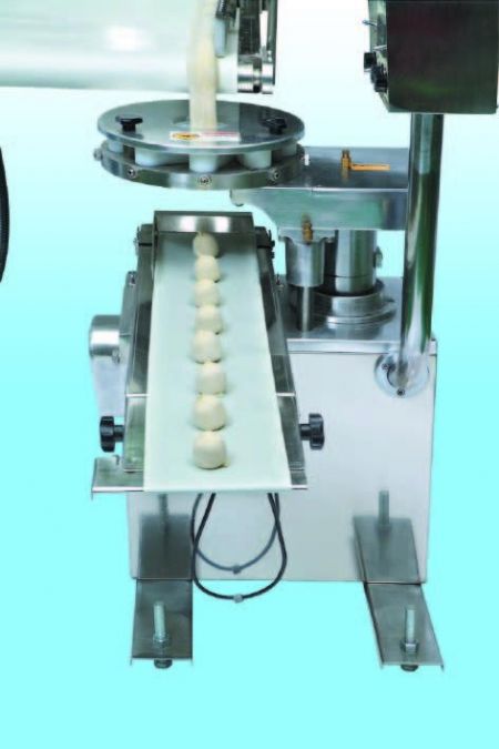 Automatic Layer & Stuffed Paratha Production Line - The plain or stuffed dough bar goes through the wrapping mechanism to be formed into dough balles. The both ends are closed to keep from the leak of stuffing and keep the layers.